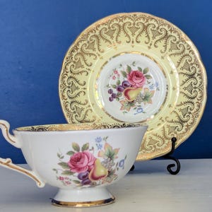 Antique Paragon Fine Bone China Teacup & Saucer – Golden Elegance with Floral Flourish
