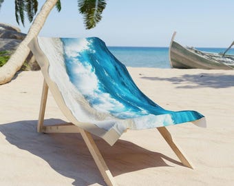 May include: A beach chair with a blue and white wave design. The chair is made of wood and has a canvas seat. The chair is sitting on a sandy beach.