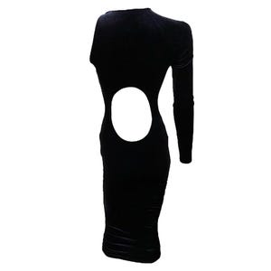 May include: A black velvet midi dress with a cut-out detail on the back. The dress has long sleeves and a fitted silhouette.