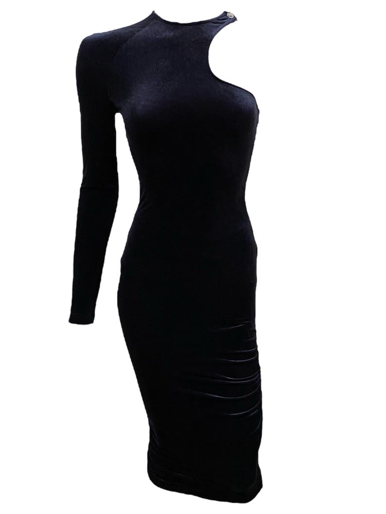 May include: A black velvet midi dress with a one-shoulder design and a single button detail.