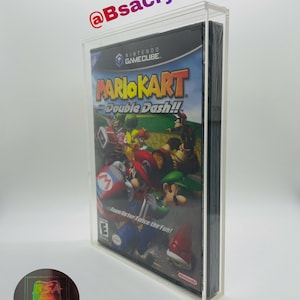 May include: Clear acrylic display case for a Nintendo GameCube game. The case is 4mm thick and UV resistant, protecting the game from damage. The game shown is Mario Kart: Double Dash!! The case has the text "@Bsacrylics".