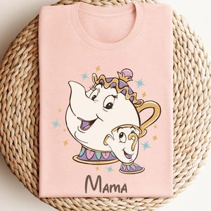 May include: Pink t-shirt with a cartoon image of Mrs. Potts and Chip from Beauty and the Beast. The text "Mama" is printed below the image.