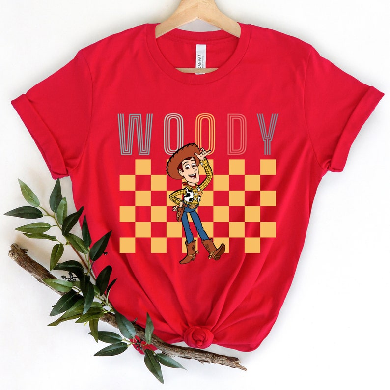 a red woody t - shirt with woody on it
