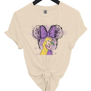 a women's t - shirt with a picture of a blonde haired girl with