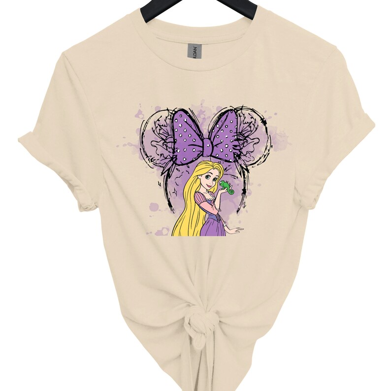 a women's t - shirt with a picture of a blonde haired girl with