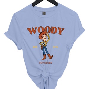 a women's blue woody toy story t - shirt