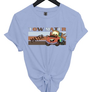 a blue shirt with a tow truck on it