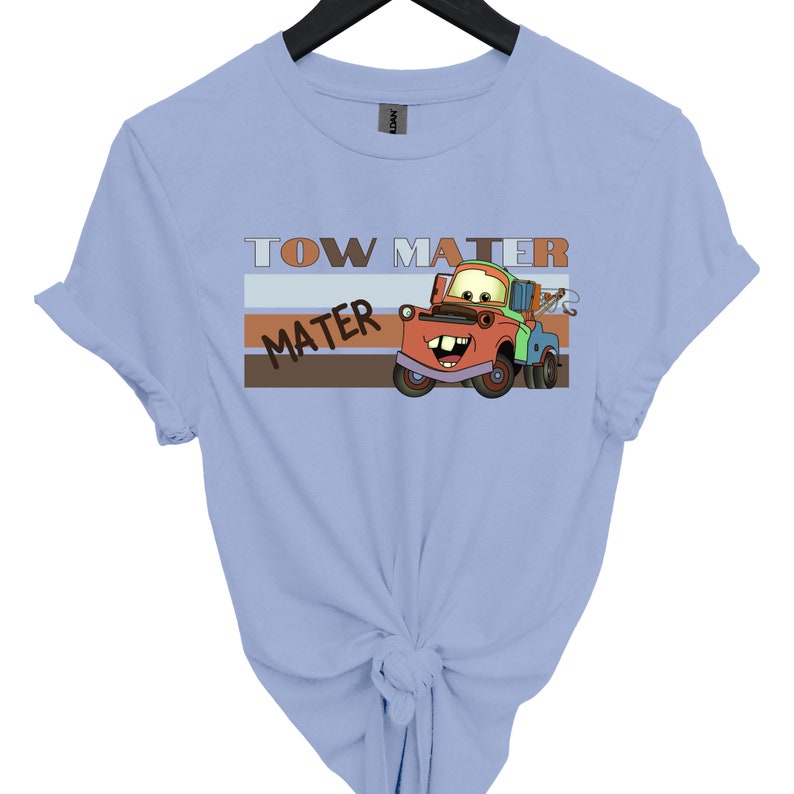 a blue shirt with a tow truck on it