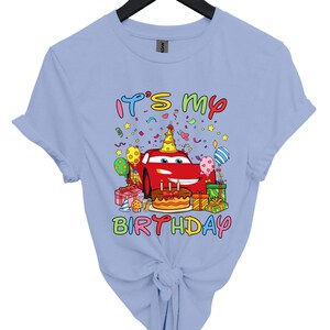 a blue shirt with a cartoon character on it