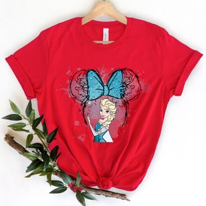 a red t - shirt with a picture of a blonde haired girl with a blue