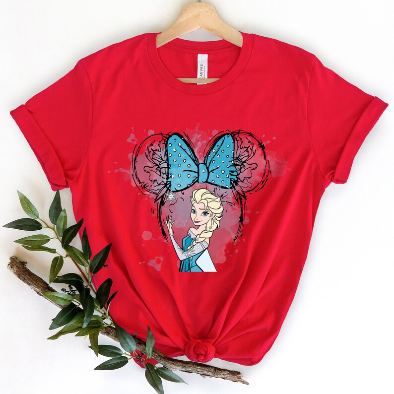 a red t - shirt with a picture of a blonde haired girl with a blue