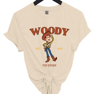 a women's t - shirt with woody on it