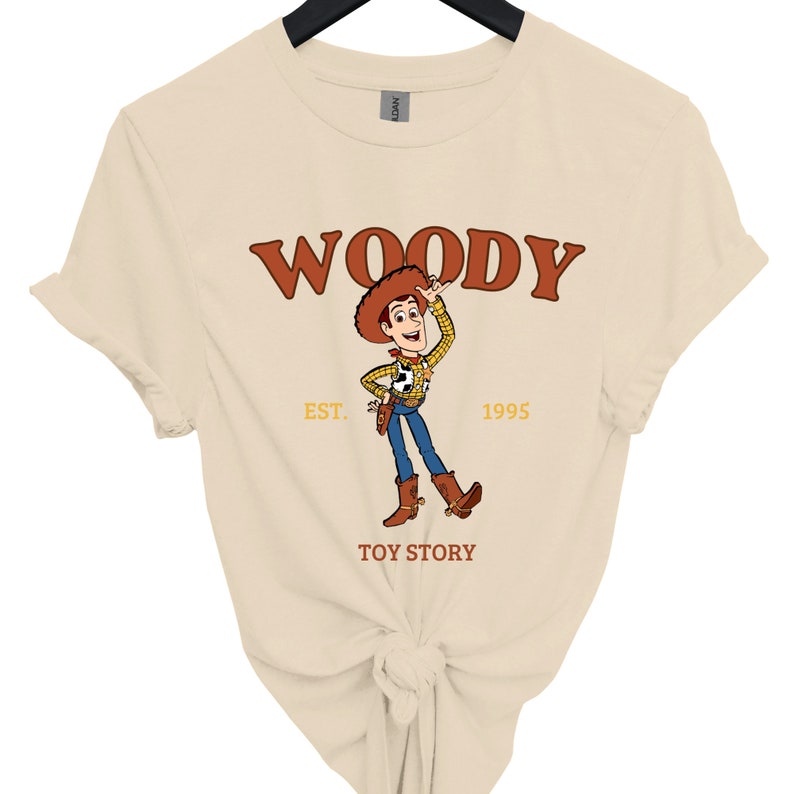 a women's t - shirt with woody on it