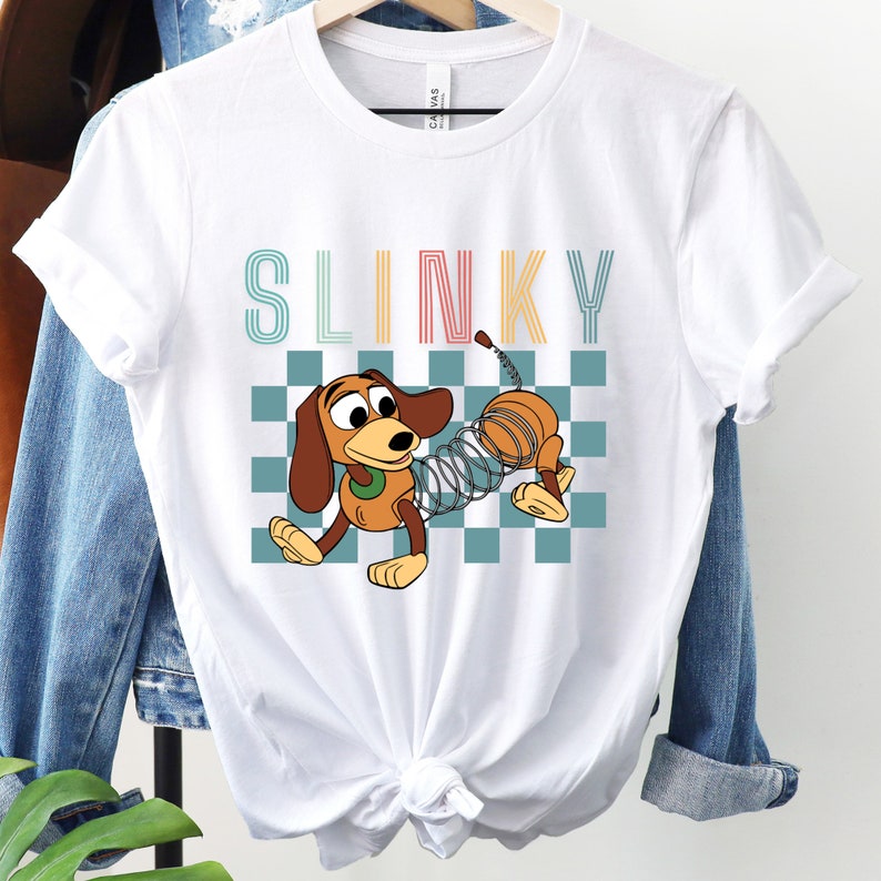 a white shirt with a cartoon dog on it
