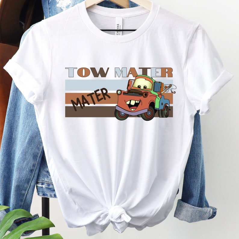 a white t - shirt with a tow truck on it