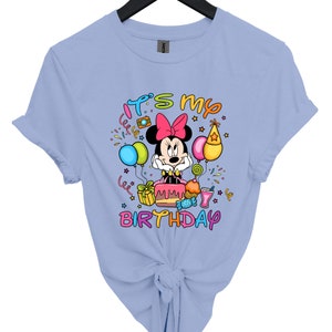 a blue tshirt with a minnie mouse design on it