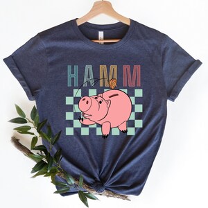 a t - shirt with a picture of a pig on it