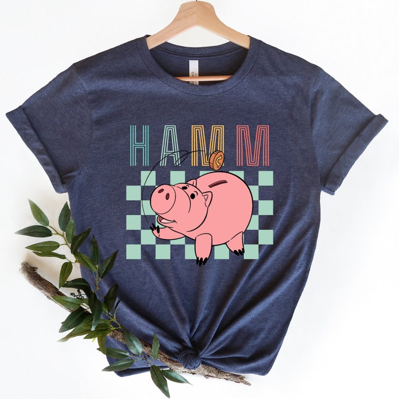 a t - shirt with a picture of a pig on it
