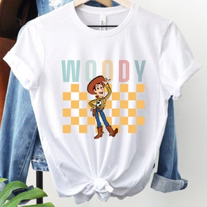 a t - shirt with a cartoon of woody on it