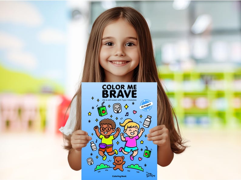 Puede incluir: Una persona joven sostiene un libro para colorear azul titulado "Color Me Brave: Life is still sweet with Type 1 Diabetes". La portada presenta una ilustraci&oacute;n de dibujos animados de dos ni&ntilde;os saltando con un osito de peluche y otros art&iacute;culos relacionados con la diabetes.