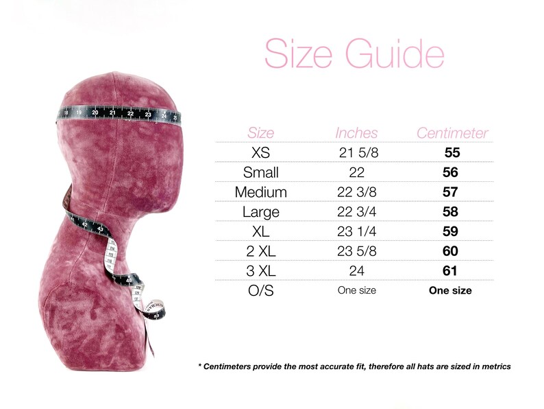 May include: A burgundy mannequin head with a measuring tape around it, displaying a size guide for hats. The guide lists sizes XS to 3XL, with corresponding measurements in inches and centimeters, ranging from 21 5/8 inches (55 cm) to 24 inches (61 cm).