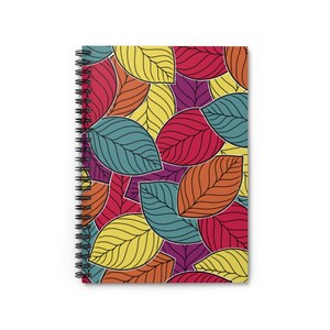 May include: A spiral bound notebook with a colorful leaf pattern. The leaves are in shades of red, orange, yellow, green, and purple.