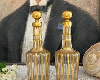 Pair of fine gold Baccarat liqueur decanters