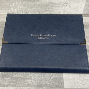 Navy cabrini board-supported document wallet front cover with square nickel corners and silver foil personalisation in the centre of the wallet.