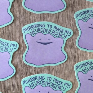 May include: Five stickers featuring a purple cartoon character with a light blue outline. The character is a blob with a smiling face. The stickers have the text "Mirroring to mask my neurodivergency" on them.