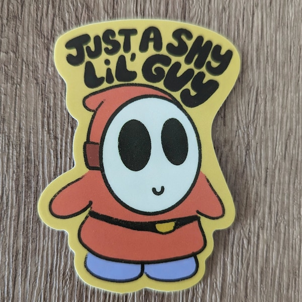 Pegatina laminada de vinilo "Just a Shy Lil' Guy" de Mario, un chico tímido y adorable