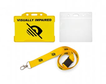 May include: A yellow horizontal badge holder with the text VISUALLY IMPAIRED and a black eye icon, a clear plastic badge holder, and a yellow lanyard featuring a repeating black eye icon with a metal lobster clasp and a black plastic buckle.