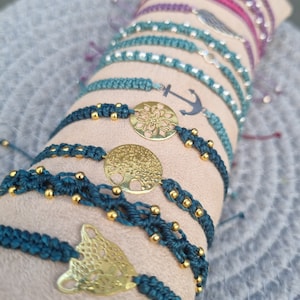Various macrame bracelets with charms or beads