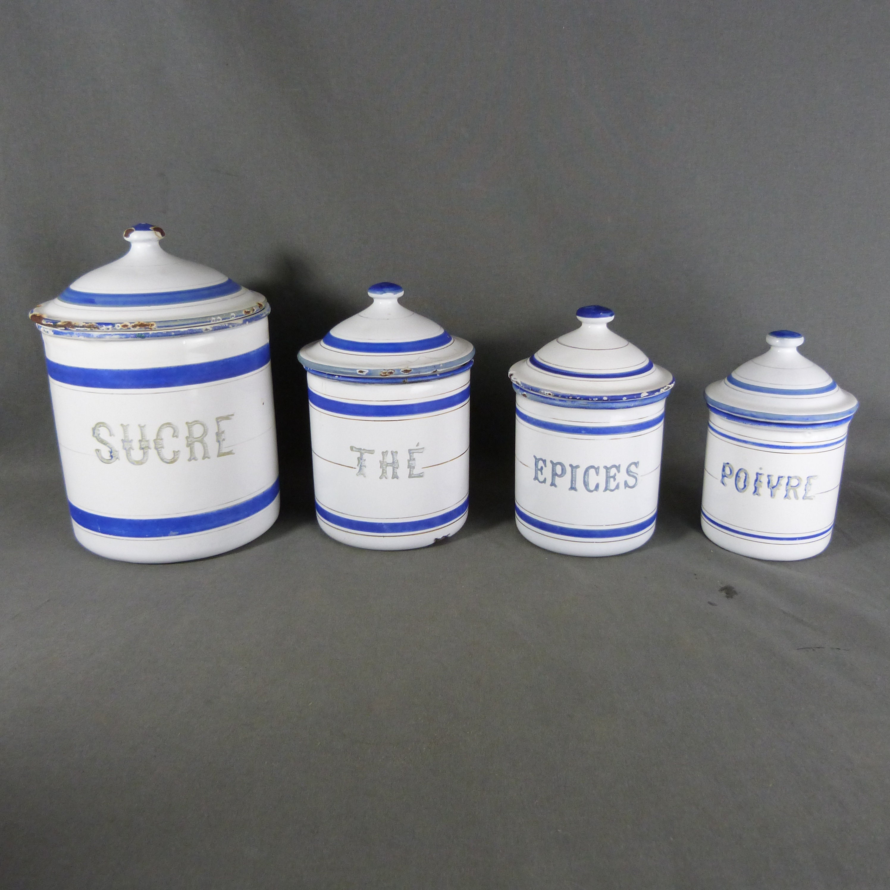 Vintage French Enamel Canister Set Of Four in White With Blue Art Nouveau Design