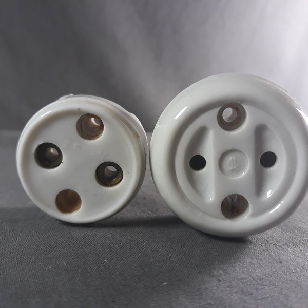 Pair of vintage round porcelain sockets, one small and one larger
