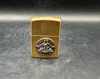 Brass Zippo A IX Lighter with 10th Anniversary Harley Owners Group on face - Never been used