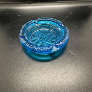 Blue 4 1/2&quot; round Glass Ashtray with angled cut marks in bottom