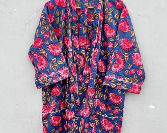May include: A blue and pink floral print robe with a white trim. The robe has a long, flowing design and a tie closure.