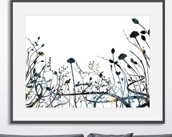 May include: A black and white abstract art print featuring a silhouette of stylised plants and flowers with gold accents. The print is on a white background.