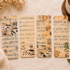 May include: Four rectangular bookmarks featuring a vintage-style beige background with printed musical notation, coffee-themed illustrations including French presses and cups, and text reading COFFEE & CHORDS, Morning Melody, and SPRING COFFEE.