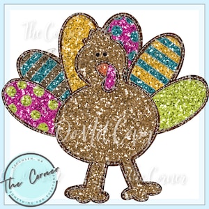 May include: A brown glitter turkey with a colorful patchwork design on its tail feathers. The turkey has a pink wattle and a brown body with a glittery finish.