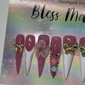 2XL Acrylic Stiletto Nails - Luxury White Nails w a Deep Pink Base, French-Tips, Bling Rhinestones, 3D Flowers & Gold Charms