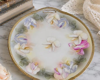 Piatto da torta con manici in porcellana R.S. Germany, 25 cm, con decorazione floreale.