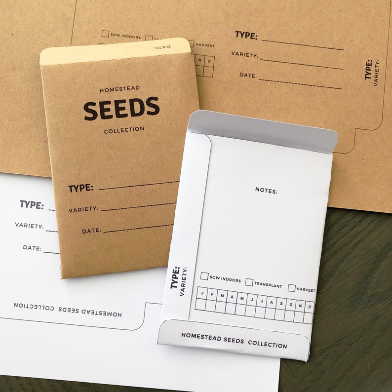 May include: A set of brown paper envelopes with white labels for storing seeds. The labels have sections for "Type", "Variety", "Date", and "Notes". The envelopes are part of the Homestead Seeds Collection.