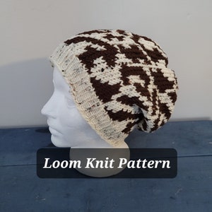May include: A brown and white knit beanie hat with a geometric pattern. The hat is on a white mannequin head. The text "Loom Knit Pattern" is on a black rectangle below the hat.