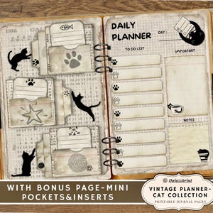 May include: Open vintage-style journal with a cat theme. The journal features a "Daily Planner" layout with to-do lists and notes sections. Includes pockets and inserts with cat paw prints, star, and fishbone designs. The journal is open on a wooden surface.