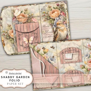 以下が含まれることがあります： ヴィンテージデザインのShabby Garden Folioペーパーセット。水彩画のイラストで花、蝶、鳥が描かれています。カラーパレットはソフトピンク、クリーム、グリーンです。セットにはポケットと封筒が含まれています。
