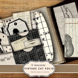 May include: A vintage cat folio with printable paper. The design features a black and white color scheme with cat silhouettes, paw prints, and measuring tape elements. The folio includes tags, pockets, and a cat illustration.