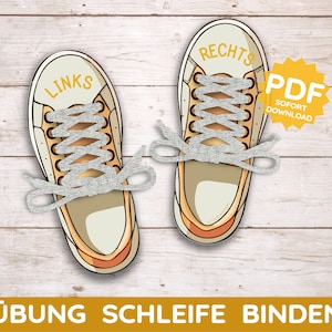 May include: A printable PDF download of two sneakers with laces. The sneakers are labeled "Links" and "Rechts" (German for "left" and "right"). The text "Übung Schleife Binden" (German for "practice tying shoelaces") is at the bottom of the image.