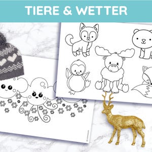 May include: A gray knit hat with white heart patterns and a pom-pom sits next to two coloring pages. The pages feature line drawings of animals and weather-related illustrations. A gold-colored deer figurine is also present. The text "TIERE & WETTER" is at the top.