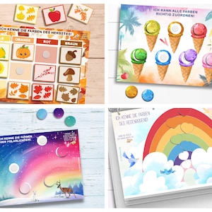 May include: Four colorful educational game boards with matching color circles. The boards feature images of autumn leaves, ice cream cones, a rainbow, and a polar aurora. The text on the boards reads "Ich kenne die Farben des Herbstes!" (I know the colors of autumn!), "Ich kann alle Farben richtig zuordnen!" (I can match all the colors correctly!), "Ich kenne die Farben des Regenbogens!" (I know the colors of the rainbow!), and "Ich kenne die Farben der Polarlichter!" (I know the colors of the aurora borealis!).